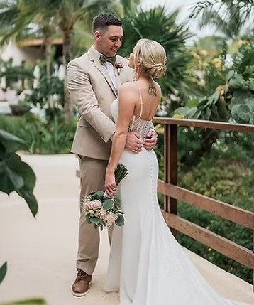 Bride and groom sharing a quiet moment at a tropical resort with help from a destination wedding travel agent