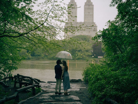 Rainy Day Photoshoots in NYC with couple posing for a kiss