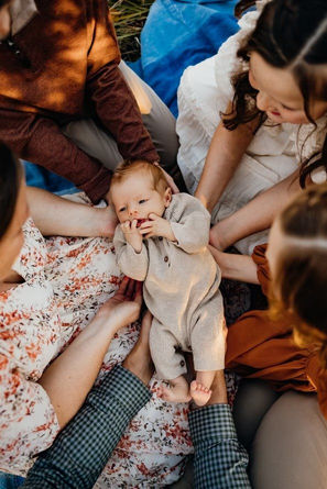 Family holding newborn at their family session in Spokane, WA