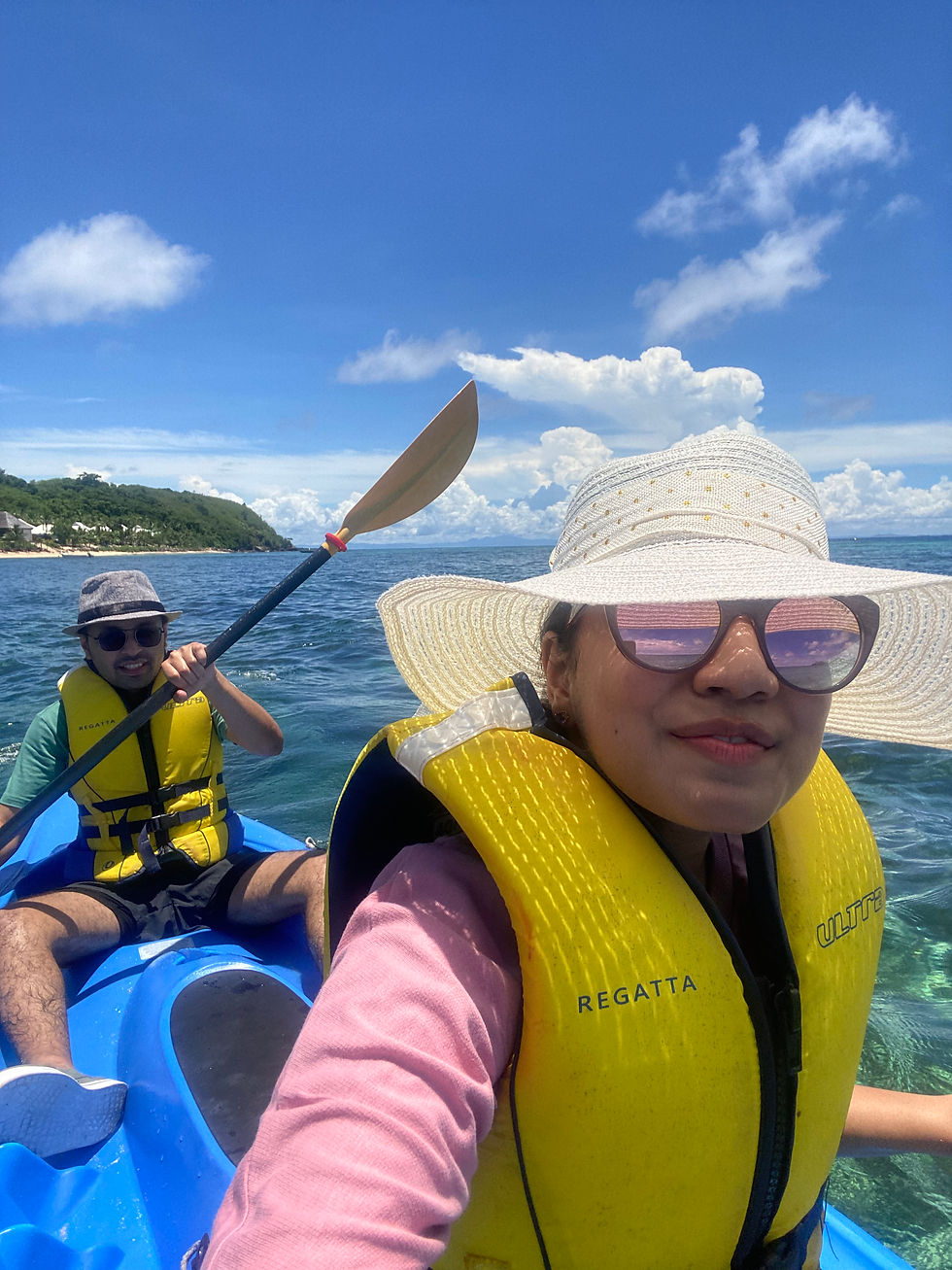 Applying nourishing body oil before a tropical holiday to support skin hydration