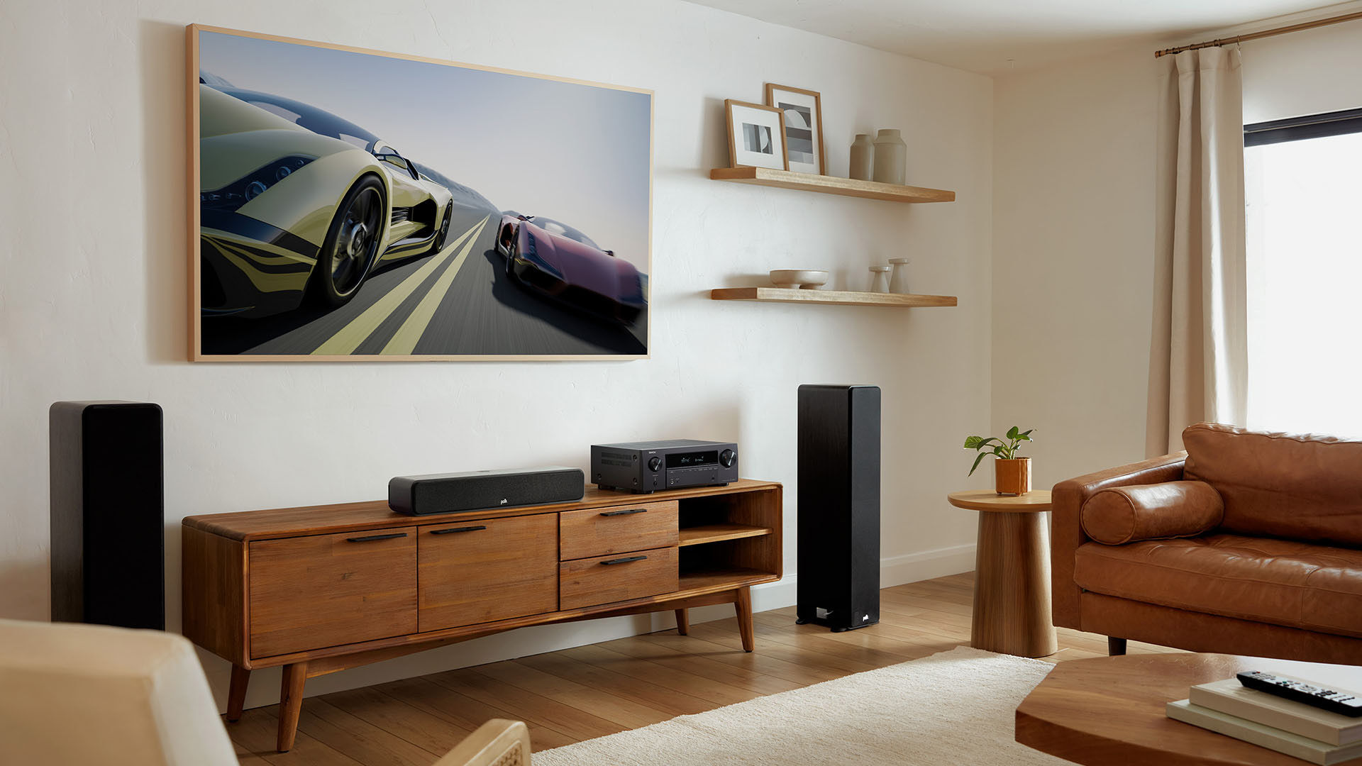 Modern living room with TV showing race cars, speakers, and wooden furniture.