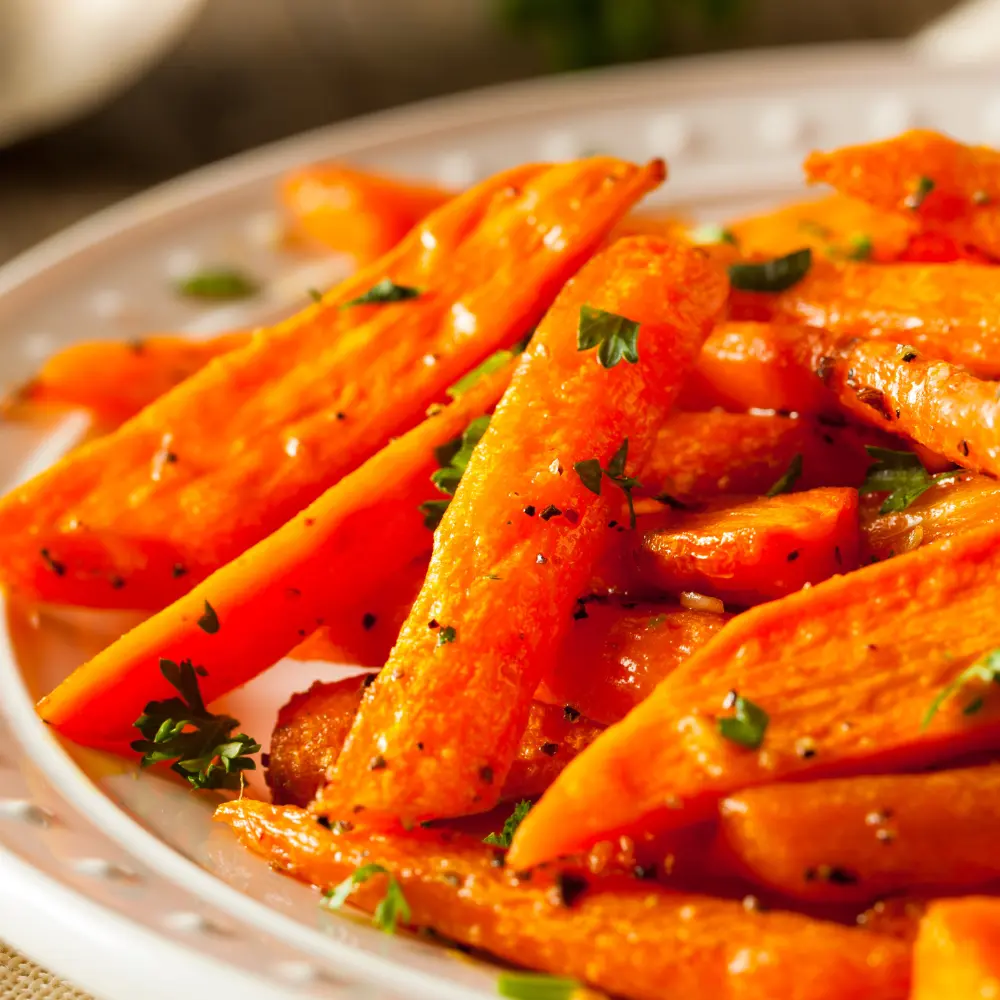 Carrot batons roasted in the oven with parsley on top