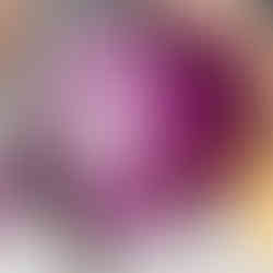 Red cabbage being cut with a knife