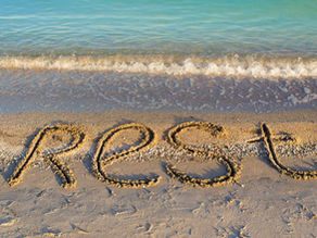 R E S T written in the sand