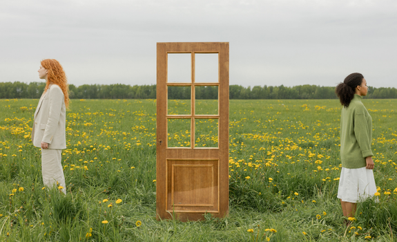 one woman on the left side and a woman on the right side with a door in the middle