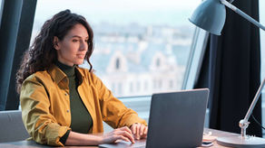 Woman typing on a laptop