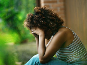 lonely woman with her head down