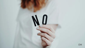 woman holding the letters N and O