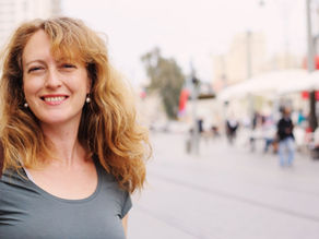 Woman over 40 smiling at the camera