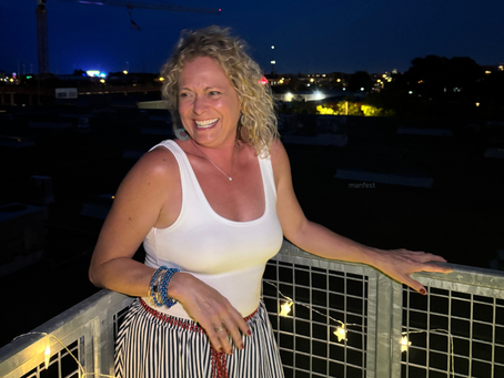 me smiling looking goofy with a dark night behind me