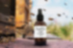 Face toner product with bees in the background.