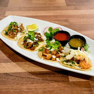 Close-up of fresh tacos served at Derwolf Pasadena for Taco Tuesday with $2 taco specials and weekly karaoke event.