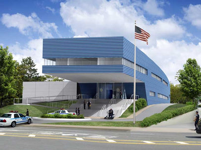 Police department with a large second floor over hanging first floor UL 752 aluminum bullet resistant storefront and double door.