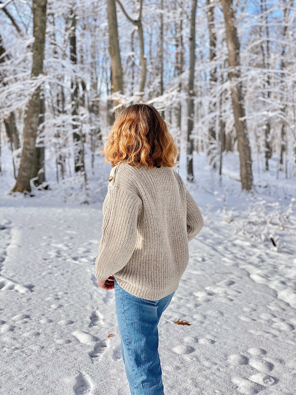 woman in snow covered forest