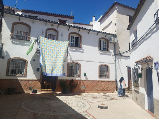 Rural coliver wandering the streets of Benarraba Spain, one of the iconic Pueblos Blancos of Andalusia.
