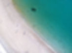 Aerial view white sand beach turquoise sea Swaying Palms Beach Bungalows