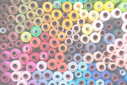 Colorful rolls of sewing thread in a box_edited.jpg