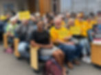 Supporters hold "NO ICE PRISONS" signs at the Alameda County Board of Supervisors on April 7