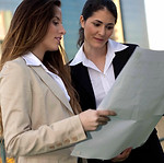 Businesswomen Reviewing Document