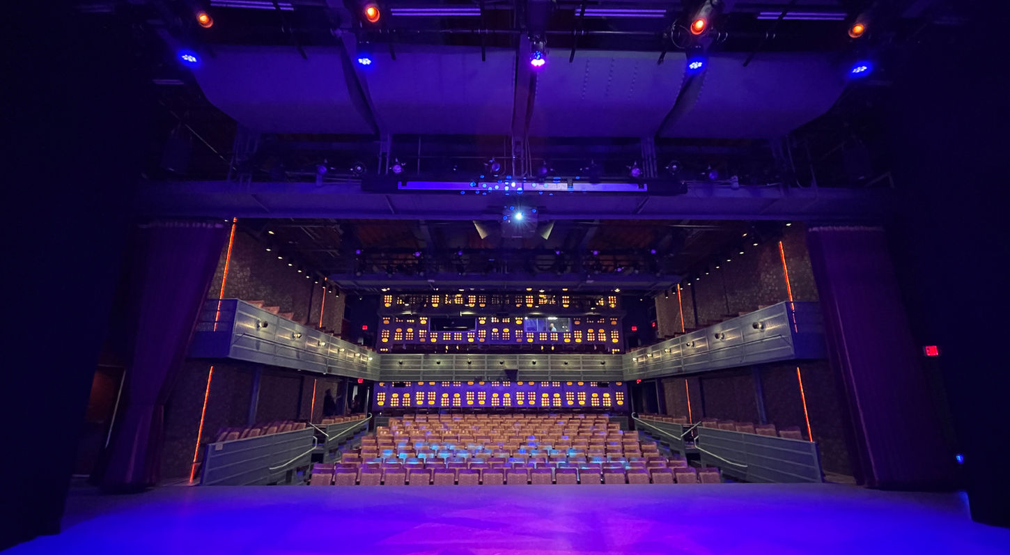 An interior view of the Plano Courtyard Theatre in the City of Plano. Looking from center stage towards the audience. The venue is unoccupied.