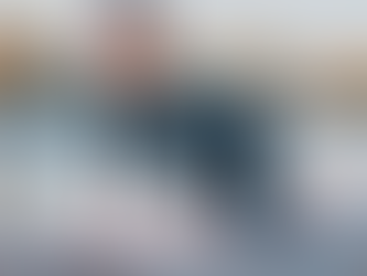 Woman doing yoga cat-dow pose outdoors