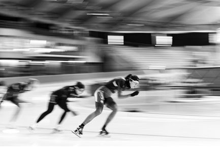 Blur of speed skaters passing by