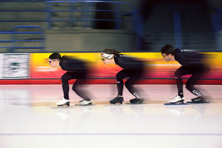 Blur of speed skaters passing by