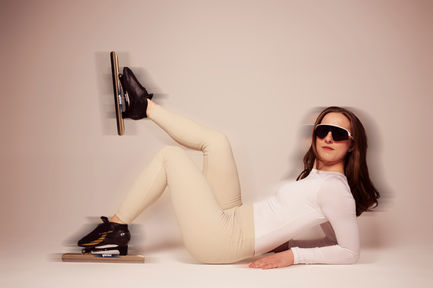 Woman in sunglasses, ice skates