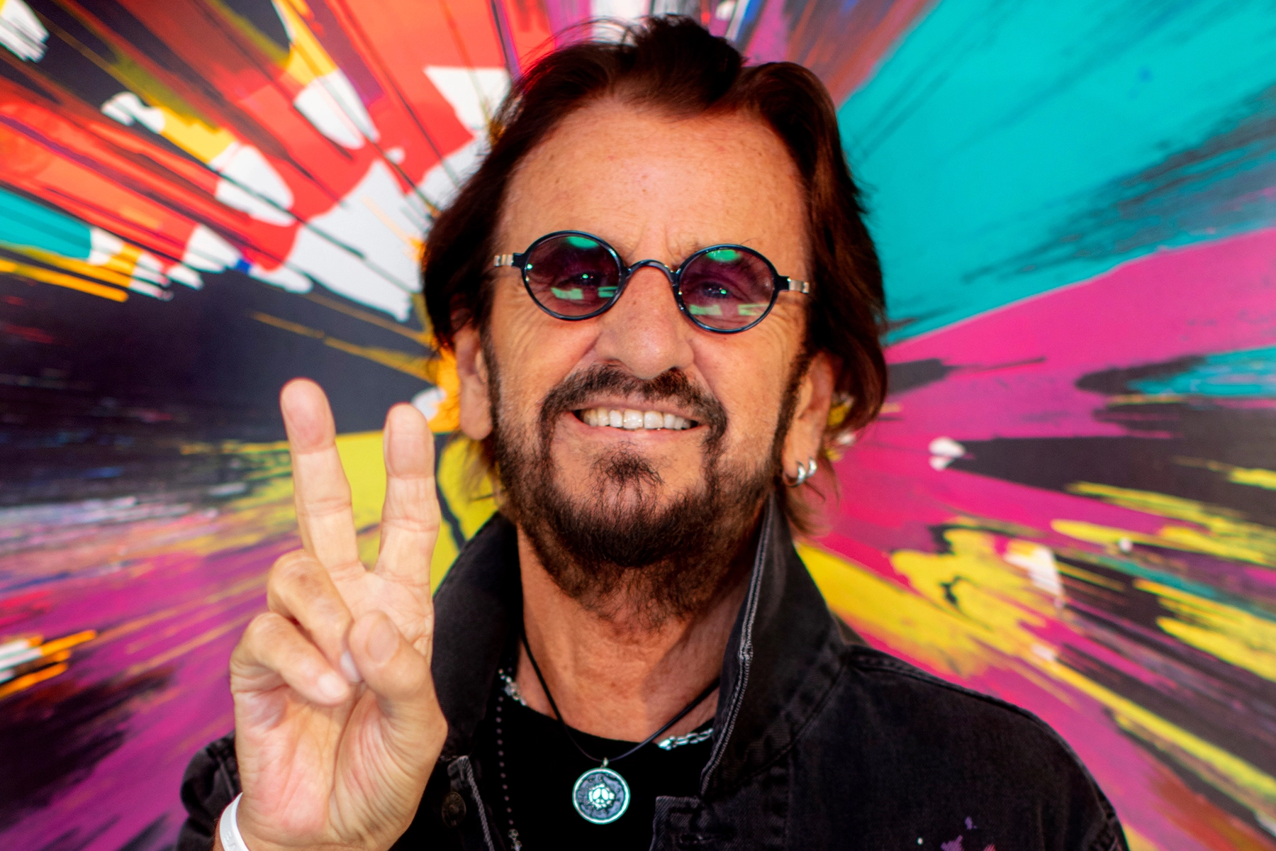 Ringo Starr Giving the Peace Sign