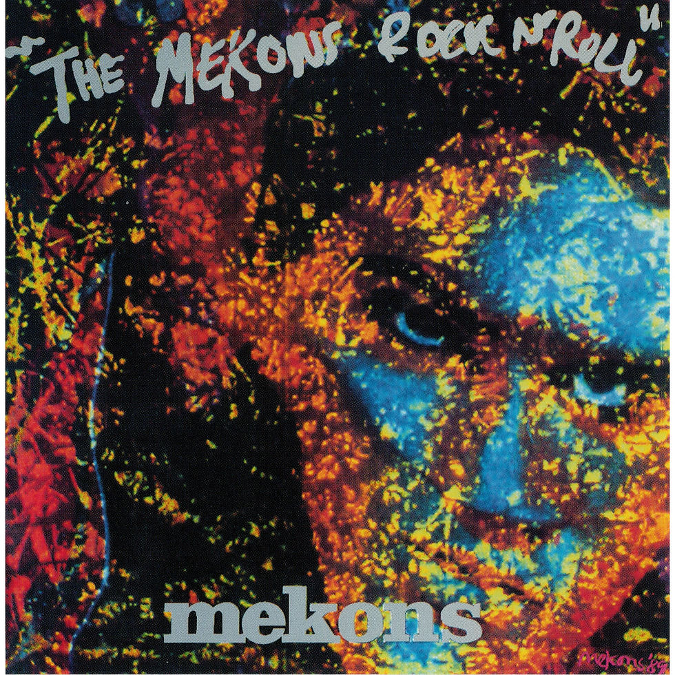 Abstract portrait with blue, yellow, and red splatters. Text reads "The Mekons Rock 'n' Roll." Bold, intense mood.