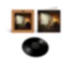 Vinyl album set with cover art of a seated person in a wooden room behind flowing sheer curtains, plus a black Capitol record.