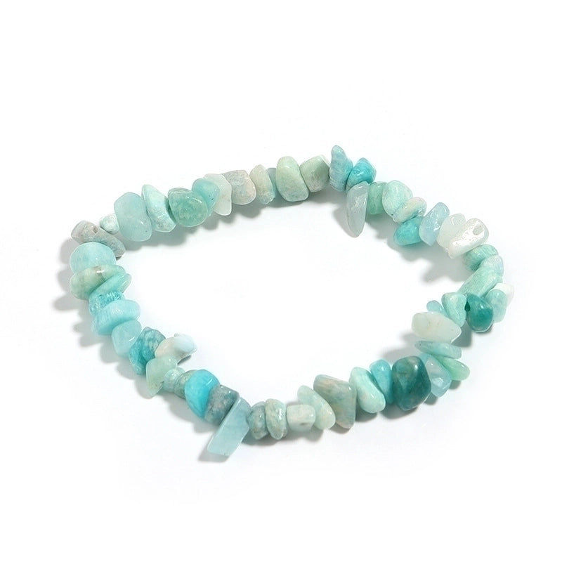 Thumbnail: A turquoise and aqua beaded bracelet made of smooth, irregular stones, creating a natural and organic appearance.
