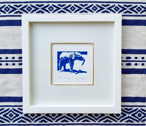 Baby elephant, blue hand print framed in white with gold leaf by wildlife artist Amy Sandys-Lumsdaine on striped backdrop