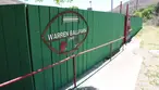 The green outfield fence and historic sign at Warren Ballpark in Bisbee, Arizona, featured on a local sports history trip with Big Jeep Tours.