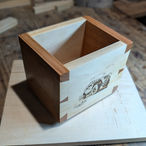 Corner view of handmade dovetail pine box with oak accents and Jeep engraving. 

