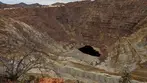 Panoramic view of the massive Lavender Pit open-pit copper mine under a cloudy sky in Bisbee, Arizona, a historic landmark featured on Big Jeep Tours.