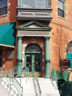 Exterior façade of the Stock Exchange Saloon in Bisbee, Arizona, circa 1905 Italianate style