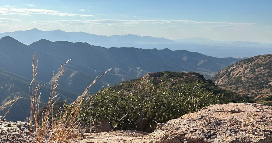 Expansive mountain ridgelines and desert valleys viewed from a high overlook on the Copper Territory Tour near Bisbee, Arizona.