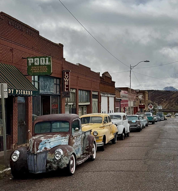 Lowell main street with vintage cars on the Old Bisbee Tour