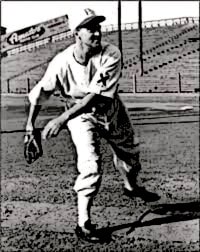 baseball player in white uniform throwing a baseball