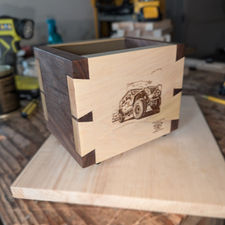 Back view of handmade dovetail box with engraved Jeep Wrangler and walnut accents. 

