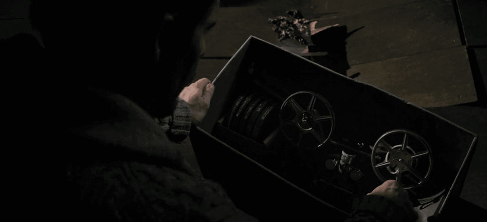 Ethan Hawke's Ellison Oswalt while moving into a new house in Chatford, Pennsylvania find a box of projector and tapes (super 8 footage) in his attic. These five tapes contain all the previous murders done by Bughuul.