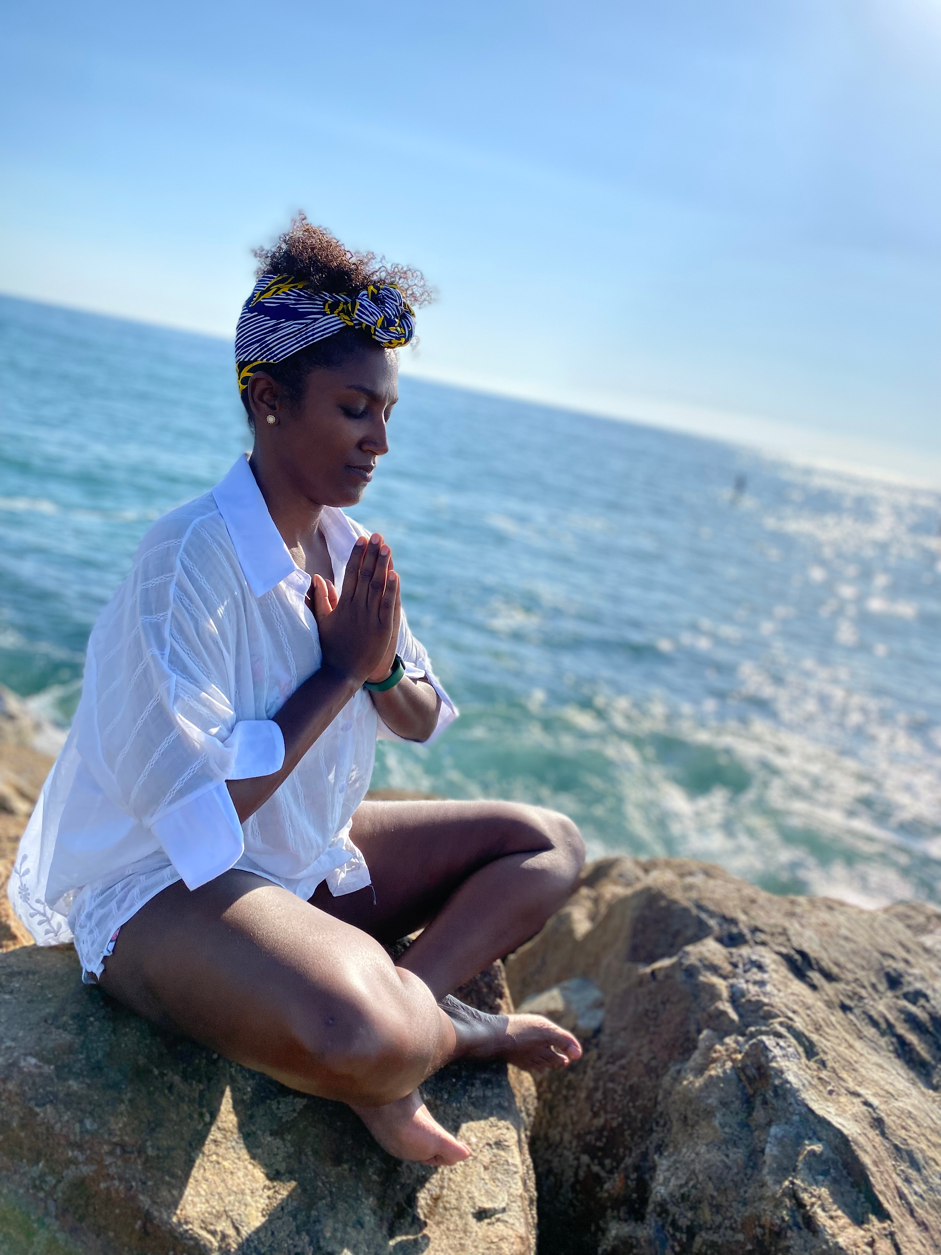 yoga pose in front of the water