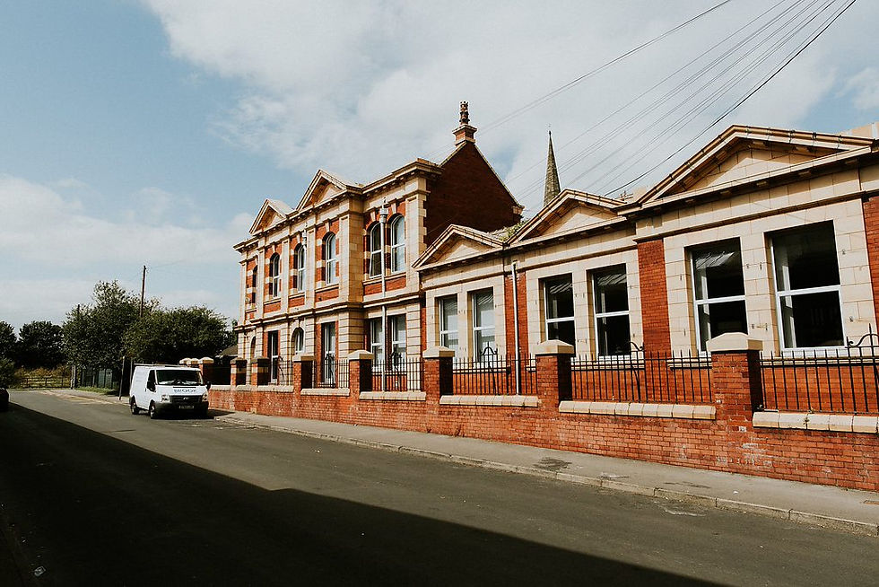 Image shows the view of the Stringer House building from the road.