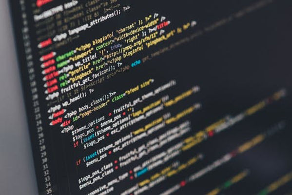 Close up with computer screen showing coding