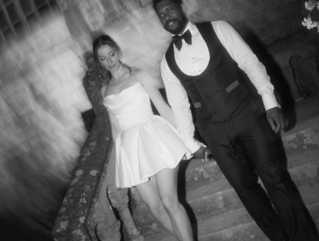 engaged couple arriving at the wedding party at night, photo in black and white