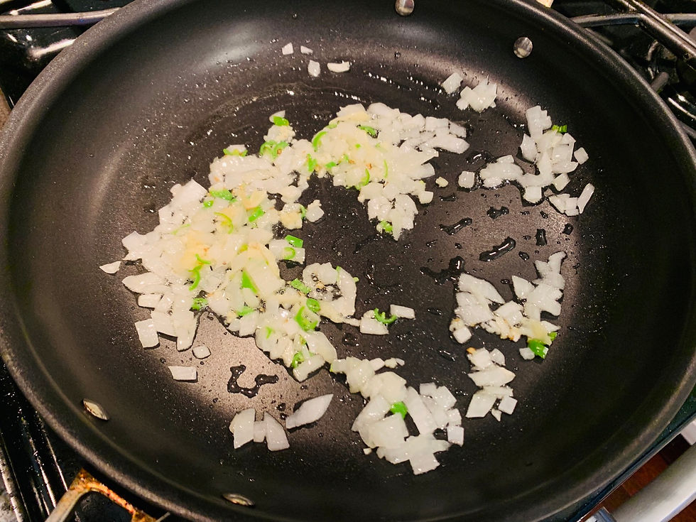 Chili, garlic, onion, cumin seed. Wide pan