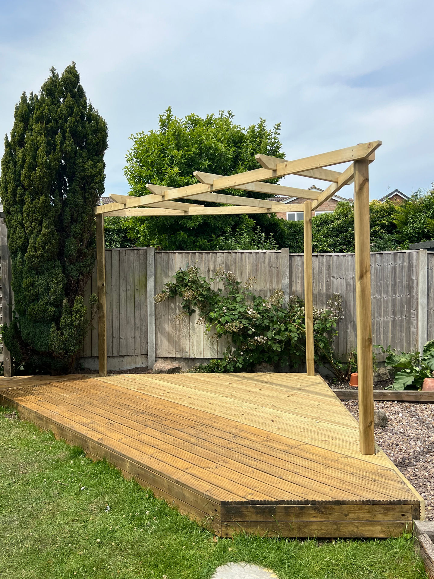 Wooden deck with a pergola and 