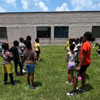 Youth learning budgeting skills during ICCF’s 'Money on the Island' activity at Island Adventures Day Camp.