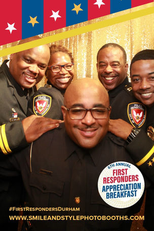 Police officers and first responders at a community appreciation event photo booth rental with a custom patriotic print by Smile And Style Photo Booth in Durham NC